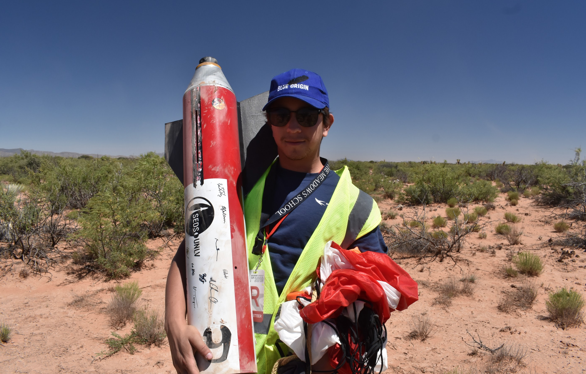 Brandon Avendano holding the rocket after recovery